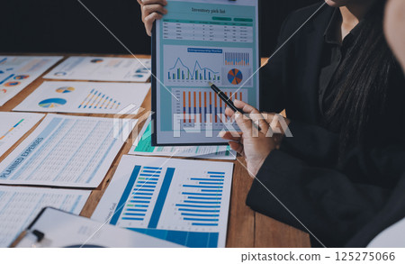 Business analyze,Close up Business people meeting to discuss the situation on the market. Business Financial Concept 125275066