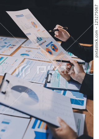 Business analyze,Close up Business people meeting to discuss the situation on the market. Business Financial Concept Business analyze,Close up Business people meeting to discuss the situation on the market. Business Financial Concept 125275067