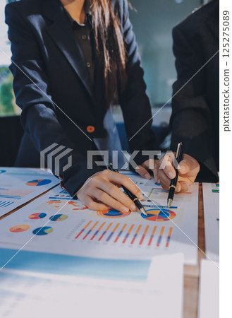 Business analyze,Close up Business people meeting to discuss the situation on the market. Business Financial Concept 125275089