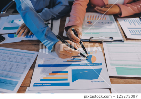Business analyze,Close up Business people meeting to discuss the situation on the market. Business Financial Concept 125275097