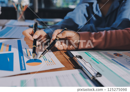 Business analyze,Close up Business people meeting to discuss the situation on the market. Business Financial Concept 125275098