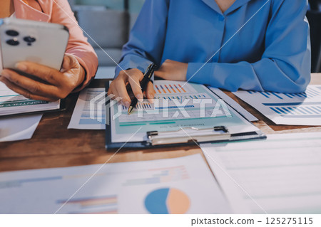 Business analyze,Close up Business people meeting to discuss the situation on the market. Business Financial Concept 125275115