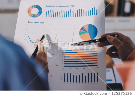 Business analyze,Close up Business people meeting to discuss the situation on the market. Business Financial Concept 125275126