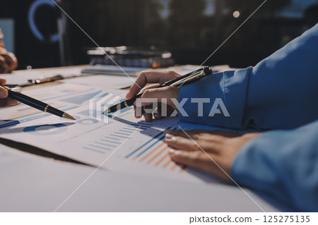 Business analyze,Close up Business people meeting to discuss the situation on the market. Business Financial Concept 125275135