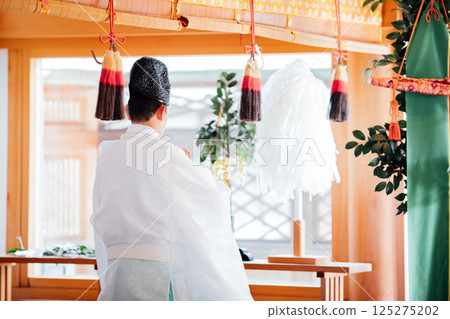 Praying at the shrine Praying at the shrine 125275202