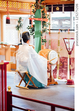 Praying at the shrine 125275206