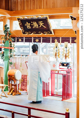 Praying at the shrine Praying at the shrine 125275212