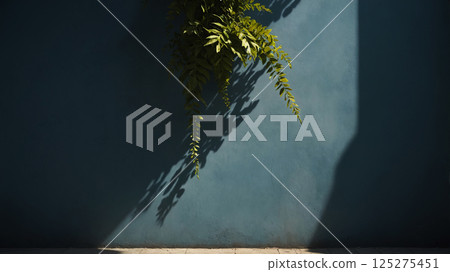 Minimalistic background with green plant branch and blurred foliage shadow on wall Minimalistic background with green plant branch and blurred foliage shadow on wall 125275451