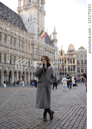 Smiling tourist at Grand Place Brussels 125275833