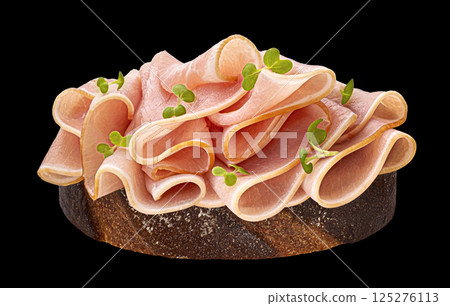 Sandwich with pork ham slices isolated on black background Sandwich with pork ham slices isolated on black background 125276113