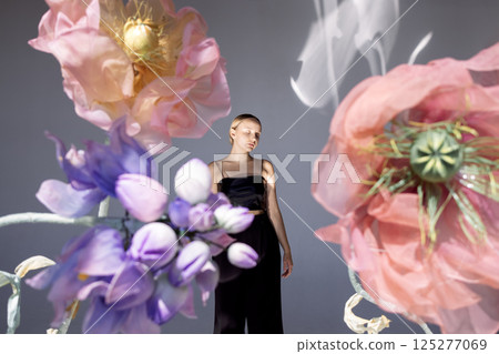 Beautiful woman wearing top on floral background 125277069