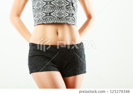 Closeup sexy alluring woman hips and belly. 125278386