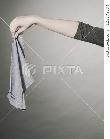Female hand with cleaning equipment. Female hand with cleaning equipment. 125278674