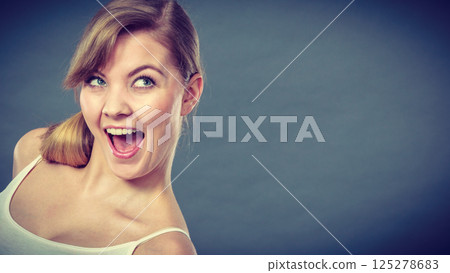 Smiling joyful girl portrait. Smiling joyful girl portrait. 125278683