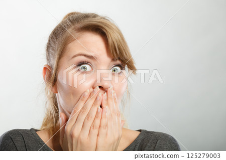 Nervous lady expressing fear. 125279003