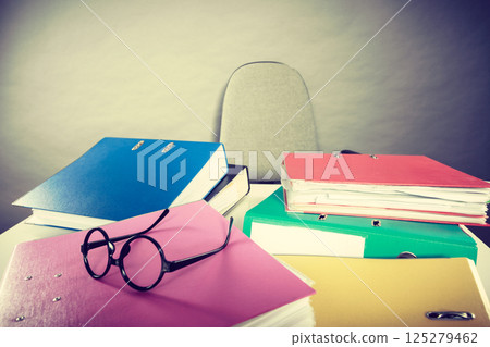 Piles of binders with documents. Piles of binders with documents. 125279462