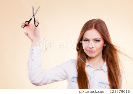 Smiling lady showing tools. 125279616