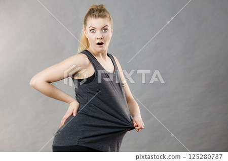 Woman wearing too big tshirt 125280787
