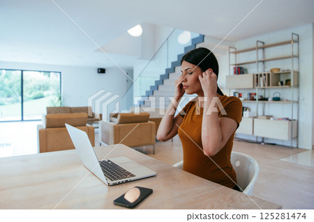 Woman sitting in living room using laptop looking at cam talk by video call with business friend relatives, head shot. Job interview answering questions 125281474