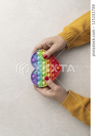 woman holding rainbow heart in hands Pride concept, woman holding rainbow heart in hands Pride concept, 125281789
