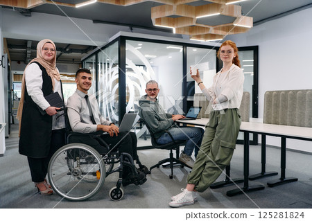 Young group of business people brainstorming together in a startup space, discussing business projects, investments, and solving challenges Young group of business people brainstorming together in a startup space, discussing business projects, investments, and solving challenges 125281824