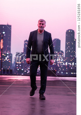 Confident Gentleman Walking in an Urban Evening Cityscape. Confident Gentleman Walking in an Urban Evening Cityscape. 125281856