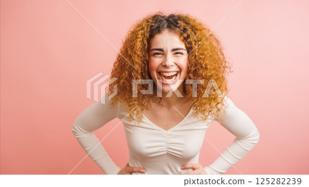Happy ethnic woman with curly hair 125282239