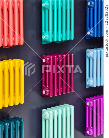 Colorful radiators displayed in an innovative home decor showroom in an urban setting during daylight hours Colorful radiators displayed in an innovative home decor showroom in an urban setting during daylight hours 125282328