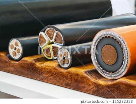 Detailed view of various electric cables on display at a construction trade show in the afternoon Detailed view of various electric cables on display at a construction trade show in the afternoon 125282358