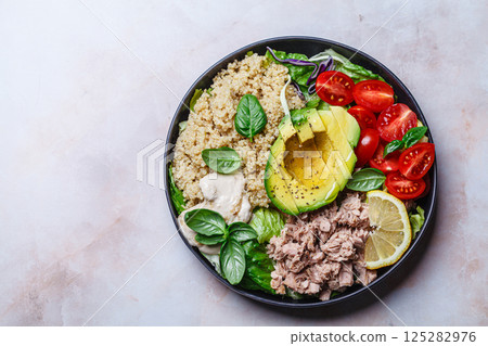 Tuna and quinoa salad with avocado and tomato. Tuna and quinoa salad with avocado and tomato. 125282976