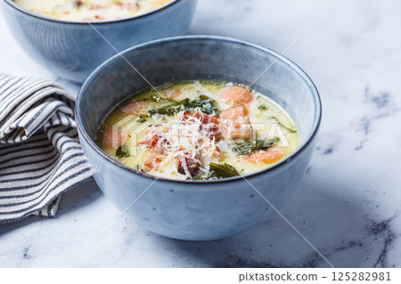 Zuppa toscana soup with sausage, bacon and potatoes. Zuppa toscana soup with sausage, bacon and potatoes. 125282981