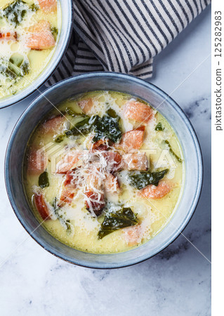 Zuppa toscana soup with sausage, bacon and potatoes. Zuppa toscana soup with sausage, bacon and potatoes. 125282983