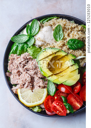Tuna and quinoa salad with avocado and tomato. Tuna and quinoa salad with avocado and tomato. 125283010