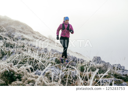 Trail Runner in Misty Mountain Landscape 125283753