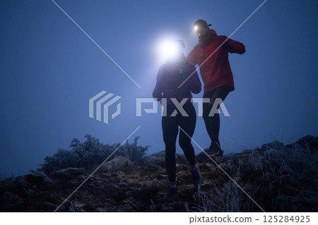 Night Trail Running in the Mountains 125284925