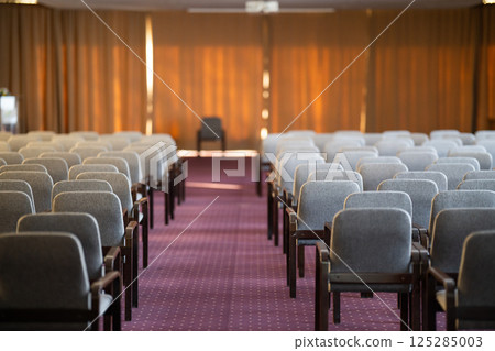 Empty Conference Hall with Rows of Chairs 125285003