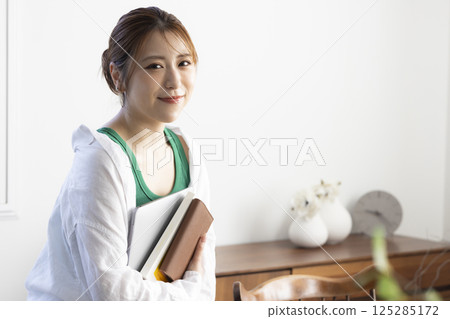 Young woman with laptop Young woman with laptop 125285172