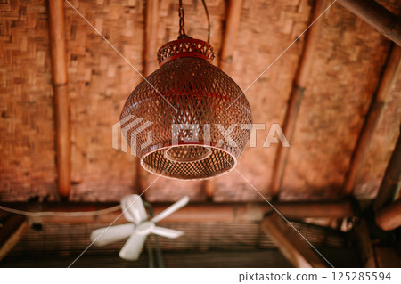old lamp on the wooden wall old lamp on the wooden wall 125285594