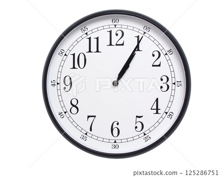 Round wall clock with black frame showing time at 01:05 or 13:05. Ideal for concepts of time or scheduling. 125286751