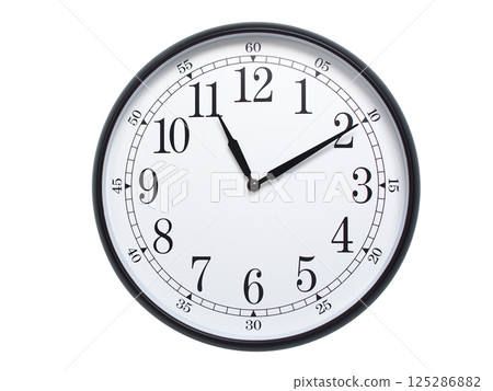 Round wall clock with black frame showing time at 11:10 or 23:10. Ideal for concepts of time or scheduling. 125286882
