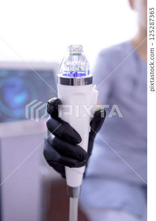 Microneedle RF lifting procedure. Hardware cosmetology. Microneedle RF lifting procedure. Hardware cosmetology. 125287365