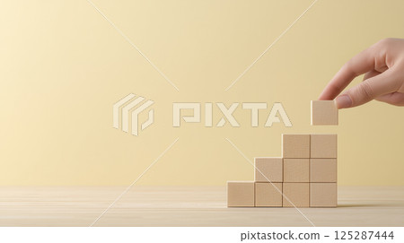 Stacking wooden blocks to create a path to success | Soft impression 125287444