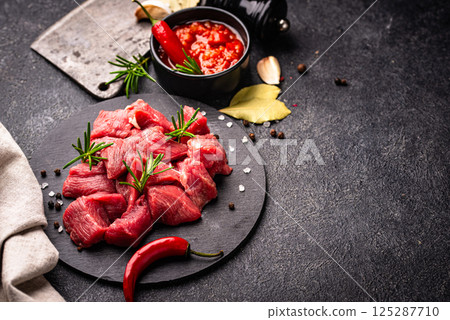 Raw beef meat and ingredients for cooking 125287710