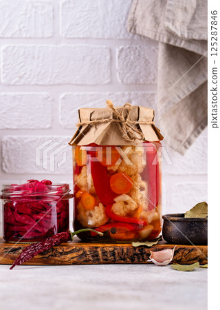 Healthy homemade fermented food in jars 125287846