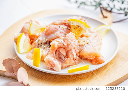 Salted lemon marinated chicken thighs Salted lemon marinated chicken thighs 125288210