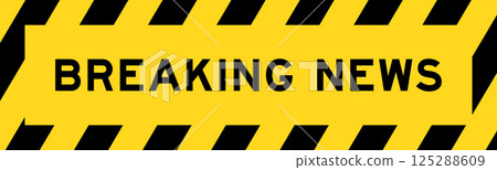 Yellow and black color with line striped label banner with word breaking news Yellow and black color with line striped label banner with word breaking news 125288609