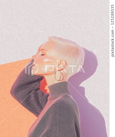profile view of woman with short blonde hair wearing sweater and earrings 125289335