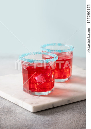 Patriotic red pomegranate margarita for July 4th. 125290173