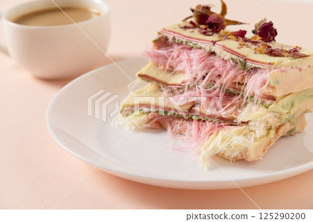 Trendy pink chocolate with airy filling on marble board. 125290200