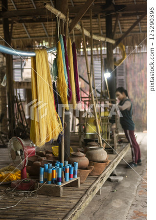 natural silk drying at traditional rural textile workshop in cambodia natural silk drying at traditional rural textile workshop in cambodia 125290396